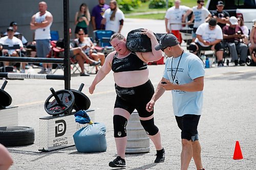 JOHN WOODS / WINNIPEG FREE PRESS
Mara Rozitis carries a sandbag as she competes in the Loading Race at the third annual Manitoba Classic Strongman Competition at Brickhouse Gym in Winnipeg Sunday, August 2, 2020. Competitors competed in the Yoke - Farmers Medley, Log Clean and Press, Loading Race, Axle Deadlift and the Tire Flip. Proceeds were donated to Little Warriors childrens charity.

Reporter: Standup