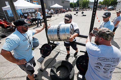JOHN WOODS / WINNIPEG FREE PRESS
Gord Grimolfson tosses a 175lb keg over the rail in the Loading Race at the third annual Manitoba Classic Strongman Competition at Brickhouse Gym in Winnipeg Sunday, August 2, 2020. Competitors competed in the Yoke - Farmers Medley, Log Clean and Press, Loading Race, Axle Deadlift and the Tire Flip. Proceeds were donated to Little Warriors childrens charity.

Reporter: Standup