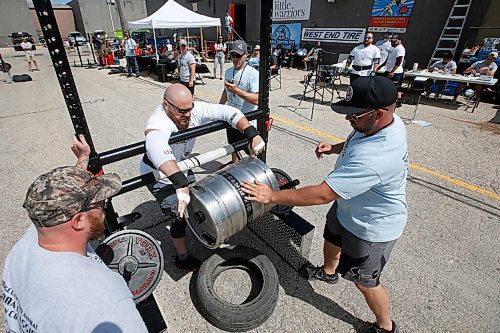 JOHN WOODS / WINNIPEG FREE PRESS
Travis Klassen tosses a 175lb keg over the rail in the Loading Race at the third annual Manitoba Classic Strongman Competition at Brickhouse Gym in Winnipeg Sunday, August 2, 2020. Competitors competed in the Yoke - Farmers Medley, Log Clean and Press, Loading Race, Axle Deadlift and the Tire Flip. Proceeds were donated to Little Warriors childrens charity.

Reporter: Standup