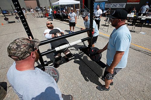 JOHN WOODS / WINNIPEG FREE PRESS
Travis Klassen carries a 200lb sandbag to the rail in the Loading Race at the third annual Manitoba Classic Strongman Competition at Brickhouse Gym in Winnipeg Sunday, August 2, 2020. Competitors competed in the Yoke - Farmers Medley, Log Clean and Press, Loading Race, Axle Deadlift and the Tire Flip. Proceeds were donated to Little Warriors childrens charity.

Reporter: Standup