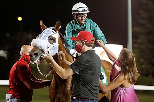 JOHN WOODS / WINNIPEG FREE PRESS
Wilmer Galviz on Mongolian Wind (5) is congratulated after winning the 72nd running of the Manitoba Derby at Assiniboia Downs in Winnipeg Monday, August 3, 2020. Mongolian Wind (5) took the big prize at the line.

Reporter: bell