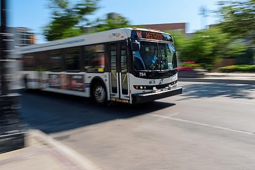 JESSE BOILY  / WINNIPEG FREE PRESS
A bus passes by on Main St. outside City Hall on Tuesday. Transit is now asking commuters to wear a mask while on transit. Tuesday, Aug. 4, 2020.
Reporter: Joyanne