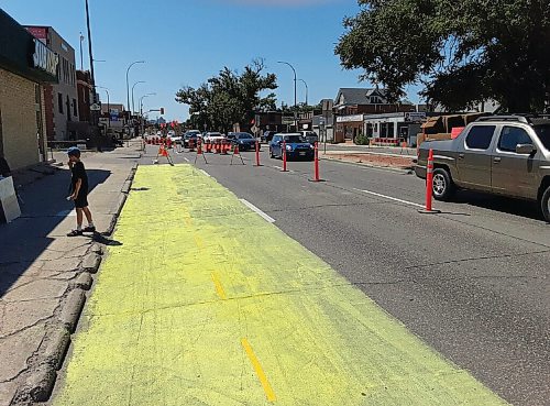 Canstar Community News A temporary bike lane on northbound Henderson Highway would allow cyclists to feel safe enough to stay off sidewalks, according to area business owner Michel Durand-Wood.