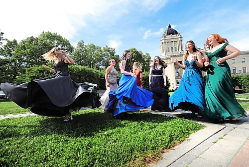 RUTH BONNEVILLE / WINNIPEG FREE PRESS

Standup photo  - Grad photos (delayed due to shipping)

A close-knit group of high school friends from J.H, Bruns School had some fun as their moms took formal photos of them in their gowns at the back of the Legislative Building on Tuesday.  They delayed taking their formal grad photos because one girls dress was delayed in shipping due to COVID (Claire Hrushka - royal blue dress in front centre)

Names by dress colour:
Royal Blue - Claire Hrushka (front centre)
Black - Aliya Robertson
Emerald Green - Allie Moffatt
Turquoise - Summer Sabourin
Navy - Kira Rumak
Red - Kyra Dyck
Taupe- Angelina Zahajko


 Aug 4th, 2020