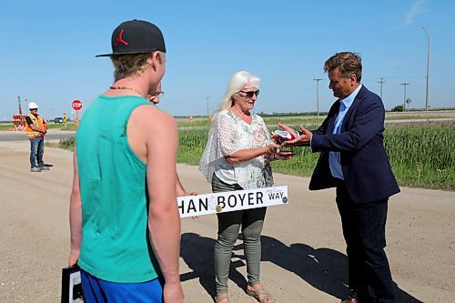 RUTH BONNEVILLE / WINNIPEG FREE PRESS

Local -  Designation of Ethan Boyer Way

Infrastructure Minister Ron Schuler designates road Ethan Boyer Way near crash site where Ethan Boyer died in 2019.  
Sue Zuk-Boyer, mother of Ethan Boyer (long white hair and green pants), Dana Boyer (dad, black t-shrt) and Reid Boyer - brother (green shirt) and family members gather together to honour Ethan near Brady Road, south of the Perimeter Highway Wednesday. 


Designation of Ethan Boyer Way

 Aug 5th, 2020