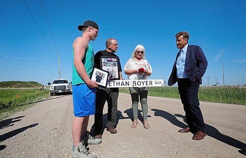 RUTH BONNEVILLE / WINNIPEG FREE PRESS

Local -  Designation of Ethan Boyer Way

Infrastructure Minister Ron Schuler designates road Ethan Boyer Way near crash site where Ethan Boyer died in 2019.  
Sue Zuk-Boyer, mother of Ethan Boyer (long white hair and green pants), Dana Boyer (dad, black t-shrt) and Reid Boyer - brother (green shirt) and family members gather together to honour Ethan near Brady Road, south of the Perimeter Highway Wednesday. 


Designation of Ethan Boyer Way

 Aug 5th, 2020