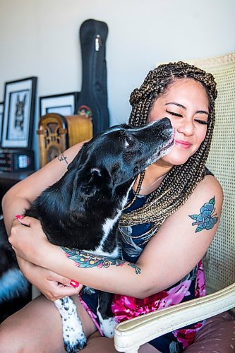 MIKAELA MACKENZIE / WINNIPEG FREE PRESS

Joanne Roberts, winner of the 2020 Gimli Film Fest Pitch Contest, poses for a portrait with her dog, Domino, at her apartment in Winnipeg on Wednesday, Aug. 5, 2020. Enjoying her home and animals are two of the five things getting her through this pandemic. For Frances Koncan story.
Winnipeg Free Press 2020.