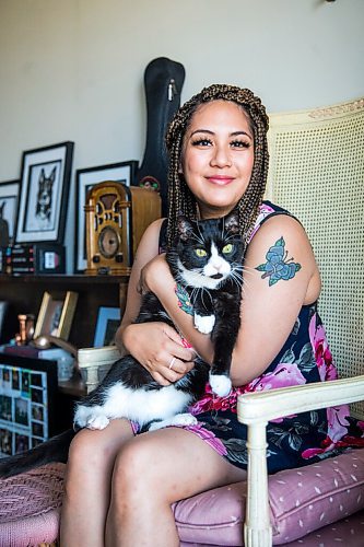MIKAELA MACKENZIE / WINNIPEG FREE PRESS

Joanne Roberts, winner of the 2020 Gimli Film Fest Pitch Contest, poses for a portrait with her cat, Percy, at her apartment in Winnipeg on Wednesday, Aug. 5, 2020. Enjoying her home and animals are two of the five things getting her through this pandemic. For Frances Koncan story.
Winnipeg Free Press 2020.