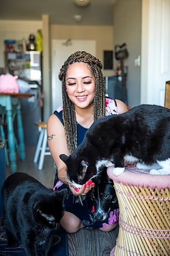 MIKAELA MACKENZIE / WINNIPEG FREE PRESS

Joanne Roberts, winner of the 2020 Gimli Film Fest Pitch Contest, poses for a portrait with her pets (dog Domino, cats Jade and Percy) at her apartment in Winnipeg on Wednesday, Aug. 5, 2020. Enjoying her home and animals are two of the five things getting her through this pandemic. For Frances Koncan story.
Winnipeg Free Press 2020.