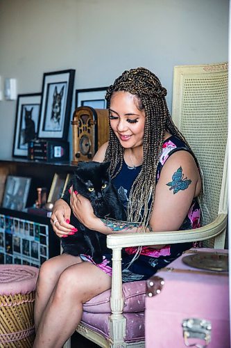 MIKAELA MACKENZIE / WINNIPEG FREE PRESS

Joanne Roberts, winner of the 2020 Gimli Film Fest Pitch Contest, poses for a portrait with her cat, Jade, at her apartment in Winnipeg on Wednesday, Aug. 5, 2020. Enjoying her home and animals are two of the five things getting her through this pandemic. For Frances Koncan story.
Winnipeg Free Press 2020.
