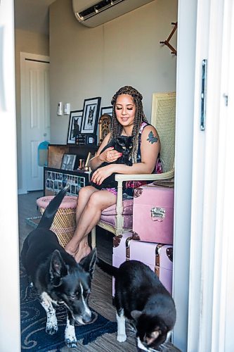 MIKAELA MACKENZIE / WINNIPEG FREE PRESS

Joanne Roberts, winner of the 2020 Gimli Film Fest Pitch Contest, poses for a portrait with her pets (cat Jade on her lap, Domino the dog and Percy the cat at the bottom) at her apartment in Winnipeg on Wednesday, Aug. 5, 2020. Enjoying her home and animals are two of the five things getting her through this pandemic. For Frances Koncan story.
Winnipeg Free Press 2020.