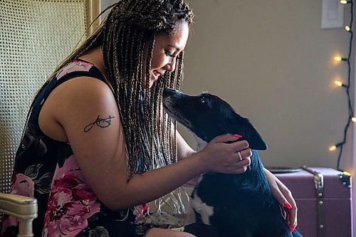 MIKAELA MACKENZIE / WINNIPEG FREE PRESS

Joanne Roberts, winner of the 2020 Gimli Film Fest Pitch Contest, poses for a portrait with her dog, Domino, at her apartment in Winnipeg on Wednesday, Aug. 5, 2020. Enjoying her home and animals are two of the five things getting her through this pandemic. For Frances Koncan story.
Winnipeg Free Press 2020.