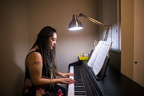 MIKAELA MACKENZIE / WINNIPEG FREE PRESS

Joanne Roberts, winner of the 2020 Gimli Film Fest Pitch Contest, plays piano at her apartment in Winnipeg on Wednesday, Aug. 5, 2020. Enjoying her home and animals are two of the five things getting her through this pandemic. For Frances Koncan story.
Winnipeg Free Press 2020.