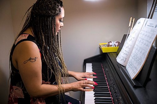 MIKAELA MACKENZIE / WINNIPEG FREE PRESS

Joanne Roberts, winner of the 2020 Gimli Film Fest Pitch Contest, plays piano at her apartment in Winnipeg on Wednesday, Aug. 5, 2020. Enjoying her home and animals are two of the five things getting her through this pandemic. For Frances Koncan story.
Winnipeg Free Press 2020.