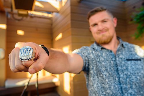 JESSE BOILY  / WINNIPEG FREE PRESS
Adam Bighill shows off their new Grey Cup ring at Confusion Corner Drinks & Food on Thursday. Thursday, Aug. 6, 2020.
Reporter: