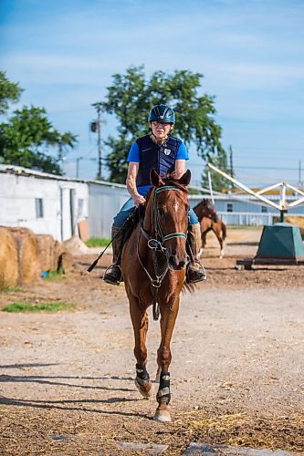 MIKAELA MACKENZIE / WINNIPEG FREE PRESS

Marion Johnston rides back to the barn on Wire Me The Money at the Assiniboia Downs backstretch in Winnipeg on Friday, Aug. 7, 2020. The three trainers are having a career year. For George Williams story.
Winnipeg Free Press 2020.