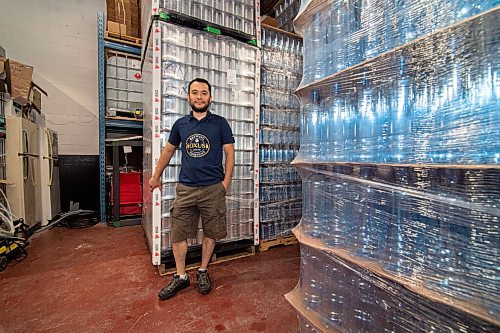 Mike Sudoma / Winnipeg Free Press
Oxus Brewing Company owner, Sean Shoyoqubov, standing in front of a case of aluminum cans used to can beer inside his brewery Friday afternoon
August 7, 2020