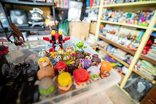 Mike Sudoma / Winnipeg Free Press
Garfield and Kermit figures align one of the shelves of Nathan Finlaysons basement laundry room. Just a small piece of Nathans massive collection of toys and memorabilia
August 7, 2020