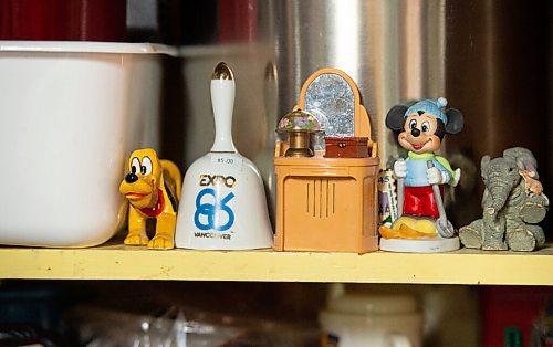 Mike Sudoma / Winnipeg Free Press
Collectables align the shelves of Seans basement laundry room, including a bell from World Expo 86.
August 7, 2020