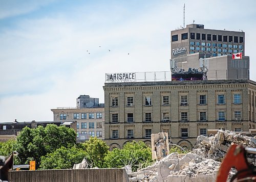 Mike Sudoma / Winnipeg Free Press
The Art Space Building stands high above the remains of the Pubic Safety Building as demolition of the building and parking structure enters its final days
August 7, 2020