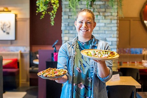 MIKAELA MACKENZIE / WINNIPEG FREE PRESS

Dana Cherski, who owns Juneberry along with three others, poses for a portrait with baby fried potatoes (left) and Honduran balaedas in the new breakfast/lunch spot in Winnipeg on Monday, Aug. 10, 2020. The restaurant has been hopping since opening in July -- no small feat amid a pandemic. For Jen Zoratti story.
Winnipeg Free Press 2020.