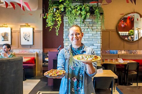 MIKAELA MACKENZIE / WINNIPEG FREE PRESS

Dana Cherski, who owns Juneberry along with three others, poses for a portrait with baby fried potatoes (left) and Honduran balaedas in the new breakfast/lunch spot in Winnipeg on Monday, Aug. 10, 2020. The restaurant has been hopping since opening in July -- no small feat amid a pandemic. For Jen Zoratti story.
Winnipeg Free Press 2020.