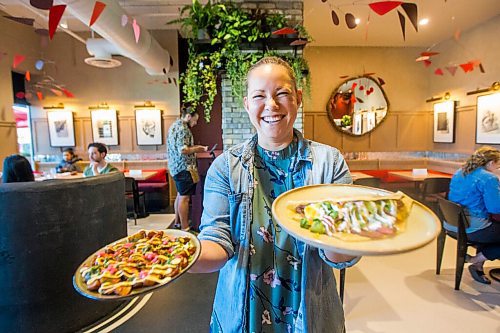 MIKAELA MACKENZIE / WINNIPEG FREE PRESS

Dana Cherski, who owns Juneberry along with three others, poses for a portrait with baby fried potatoes (left) and Honduran balaedas in the new breakfast/lunch spot in Winnipeg on Monday, Aug. 10, 2020. The restaurant has been hopping since opening in July -- no small feat amid a pandemic. For Jen Zoratti story.
Winnipeg Free Press 2020.