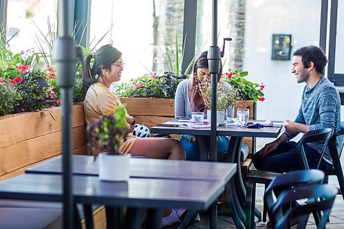 MIKAELA MACKENZIE / WINNIPEG FREE PRESS

Bon Castillo (left), Dorothy You, and Sam Marleau enjoy the patio at Juneberry, a new breakfast/lunch spot in Winnipeg on Monday, Aug. 10, 2020. The restaurant has been hopping since opening in July -- no small feat amid a pandemic. For Jen Zoratti story.
Winnipeg Free Press 2020.
