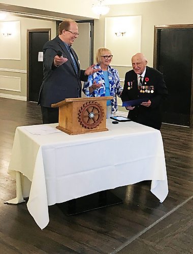 Canstar Community News Winnipeg Charleswood Rotary president Doug McKenzie and past district governor Nancy Morris present Leonord van Roon Sr. with the Paul Harris Award, in recognition of his service to our country and betterment of this community.  
