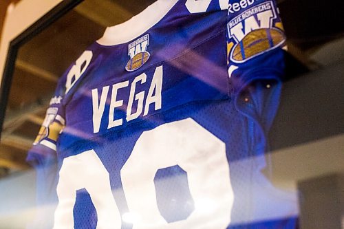 MIKAELA MACKENZIE / WINNIPEG FREE PRESS

Ex-Blue Bomber Jason Vega's framed jerseys at home in Winnipeg on Tuesday, Aug. 11, 2020. For Dave Sanderson story.
Winnipeg Free Press 2020.