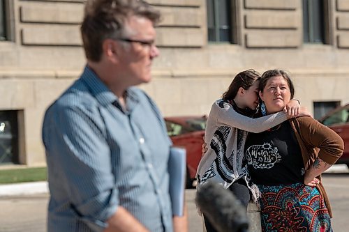 JESSE BOILY  / WINNIPEG FREE PRESS
Kisa MacIsaac, an early childhood educator, gets a hug from her daughter outside of the Legislative building on Tuesday. The Manitoba Liberals want to see more funding to early childhood care. Tuesday, Aug. 11, 2020.
Reporter: