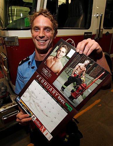 BORIS.MINKEVICH@FREEPRESS.MB.CA BORIS MINKEVICH / WINNIPEG FREE PRESS  091112 Stephane Mitton poses for a photo at Fire Station 9 with the firefighters calander he is featured as Mr. Feburary.