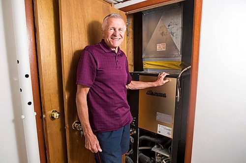 MIKAELA MACKENZIE / WINNIPEG FREE PRESS

Ed Lohrenz, geothermal heat pump expert, poses for a portrait in his home (beside the furnace system) in Winnipeg on Wednesday, Aug. 12, 2020. For Sarah story.
Winnipeg Free Press 2020.