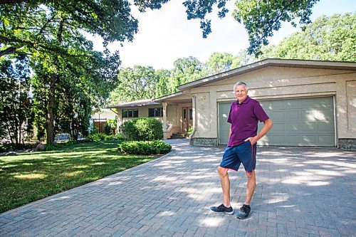 MIKAELA MACKENZIE / WINNIPEG FREE PRESS

Ed Lohrenz, geothermal heat pump expert, poses for a portrait outside of his home (which has the system) in Winnipeg on Wednesday, Aug. 12, 2020. The tubes are buried beneath the front yard. For Sarah story.
Winnipeg Free Press 2020.