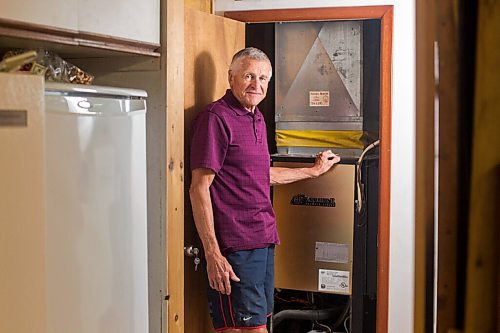 MIKAELA MACKENZIE / WINNIPEG FREE PRESS

Ed Lohrenz, geothermal heat pump expert, poses for a portrait in his home (beside the furnace system) in Winnipeg on Wednesday, Aug. 12, 2020. For Sarah story.
Winnipeg Free Press 2020.