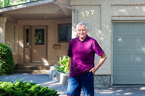 MIKAELA MACKENZIE / WINNIPEG FREE PRESS

Ed Lohrenz, geothermal heat pump expert, poses for a portrait outside of his home (which has the system) in Winnipeg on Wednesday, Aug. 12, 2020. The tubes are buried beneath the front yard. For Sarah story.
Winnipeg Free Press 2020.