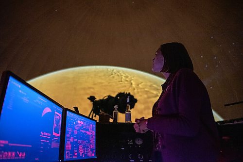 JESSE BOILY / WINNIPEG FREE PRESS
Nicole Desautels, a science communicator, shows displays some of the solar system at the planetarium on Wednesday, Aug. 12, 2020. The planetarium will be opening to the public on Thursday. 
Reporter: Standup