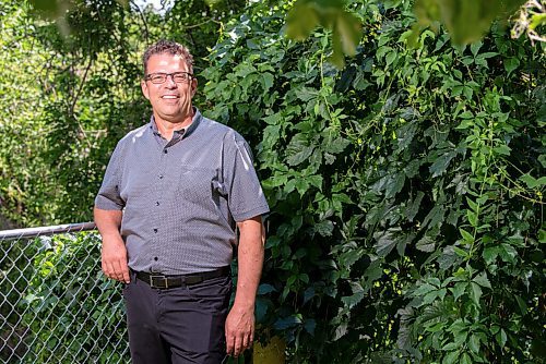 JESSE BOILY  / WINNIPEG FREE PRESS
Rev. Doug Klassen, Executive Minister of Mennonite Church Canada, stops for a portrait outside his St. James home on Wednesday. Churches are having difficulties with opening and all have different protocols for their returning plan. Wednesday, Aug. 12, 2020.
Reporter:John Longhurst