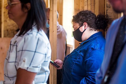 MIKAELA MACKENZIE / WINNIPEG FREE PRESS

Reporter Malak Abas at an announcement for new support for home ownership at a Habitat for Humanity construction site in Winnipeg on Thursday, Aug. 13, 2020. For marketing.
Winnipeg Free Press 2020.