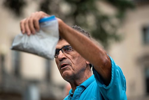 JESSE BOILY  / WINNIPEG FREE PRESS
Dennis LeNeveu, a concerned resident, shows a sample of shale to media outside the Legislature building on Thursday. Residents and the Manitoba Liberals are wanting more review and oversight of the Vivian Sand Facility Mining project in Springfield, Manitoba. Thursday, Aug. 13, 2020.
Reporter: Carol