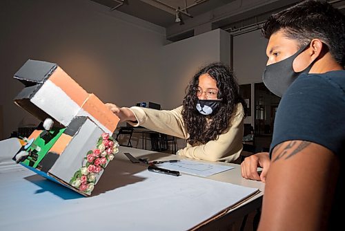 JESSE BOILY  / WINNIPEG FREE PRESS
Belahha Johnston, 16, left, learns from T.J. Richard on how to draw their model home to paper at City Builders Camp at Artspace on Thursday. Thursday, Aug. 13, 2020.
Reporter: