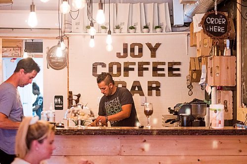 MIKAELA MACKENZIE / WINNIPEG FREE PRESS

Alex Meron Gamili, owner of Joy Coffee Bar, fulfils orders at the cozy spot in Charleswood in Winnipeg on Friday, Aug. 14, 2020. For Alison Gilmour story.
Winnipeg Free Press 2020.