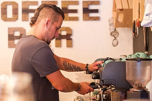 MIKAELA MACKENZIE / WINNIPEG FREE PRESS

Alex Meron Gamili, owner of Joy Coffee Bar, fulfils orders at the cozy spot in Charleswood in Winnipeg on Friday, Aug. 14, 2020. For Alison Gilmour story.
Winnipeg Free Press 2020.