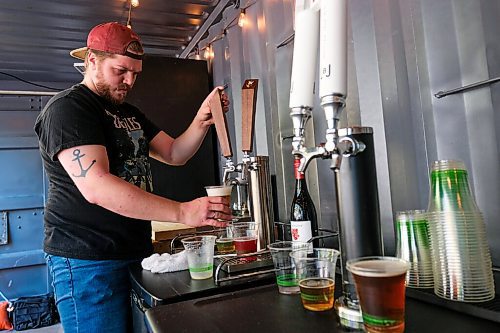 Daniel Crump / Winnipeg Free Press. Bartender Nick Reid pulls drink at Bijou Patio in Old Market Square in the Exchange District. August 15, 2020.