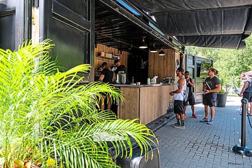 Daniel Crump / Winnipeg Free Press. Antonio Lopez (middle) and friends order drinks at Cargo Bar at Assiniboine Park. August 15, 2020.