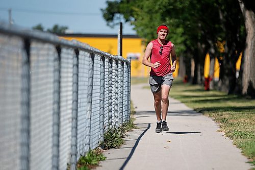 JOHN WOODS / WINNIPEG FREE PRESS
Joel Penner runs down Bannatyne Ave during the Prairie Province Prisoner Support half marathon fundraising run in Winnipeg Sunday, August 16, 2020. The fundraiser has raised more than $41,000 to assist prisoners.

Reporter: Ben