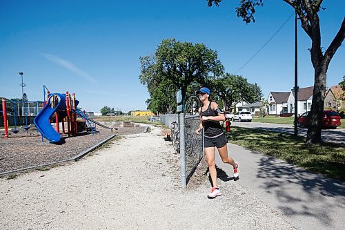 JOHN WOODS / WINNIPEG FREE PRESS
Rebecca Hume crosses the finish line at Burton Cummings Community Centre in the Prairie Province Prisoner Support half marathon fundraising run in Winnipeg Sunday, August 16, 2020. The fundraiser has raised more than $41,000 to assist prisoners.

Reporter: Ben