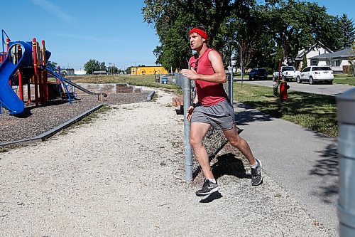 JOHN WOODS / WINNIPEG FREE PRESS
Joel Penner crosses the finish line at Burton Cummings Community Centre in the Prairie Province Prisoner Support half marathon fundraising run in Winnipeg Sunday, August 16, 2020. The fundraiser has raised more than $41,000 to assist prisoners.

Reporter: Ben