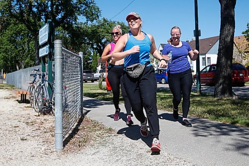 JOHN WOODS / WINNIPEG FREE PRESS
Kahleigh Krochak, from left, Johanna Theroux and Natalie Thiessen cross the finish line at Burton Cummings Community Centre in the Prairie Province Prisoner Support half marathon fundraising run in Winnipeg Sunday, August 16, 2020. The fundraiser has raised more than $41,000 to assist prisoners.

Reporter: Ben