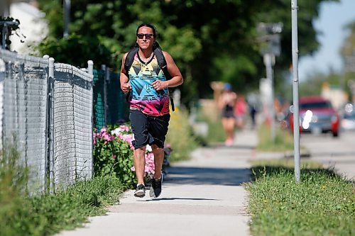 JOHN WOODS / WINNIPEG FREE PRESS
Mark Cardy runs down Logan Ave during the Prairie Province Prisoner Support half marathon fundraising run in Winnipeg Sunday, August 16, 2020. The fundraiser has raised more than $41,000 to assist prisoners.

Reporter: Ben